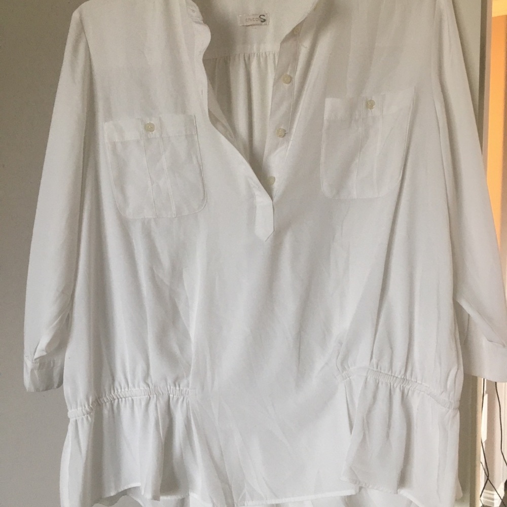 Chicos high collar silk blouse with elastic around sides and back waist .